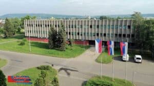 14. Oktobar office building, lawn and flagpoles