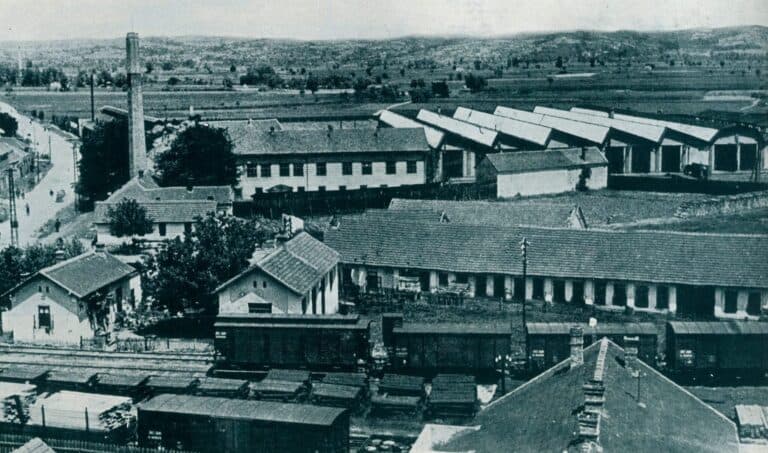 Historic aerial view of the factory buildings and chimney